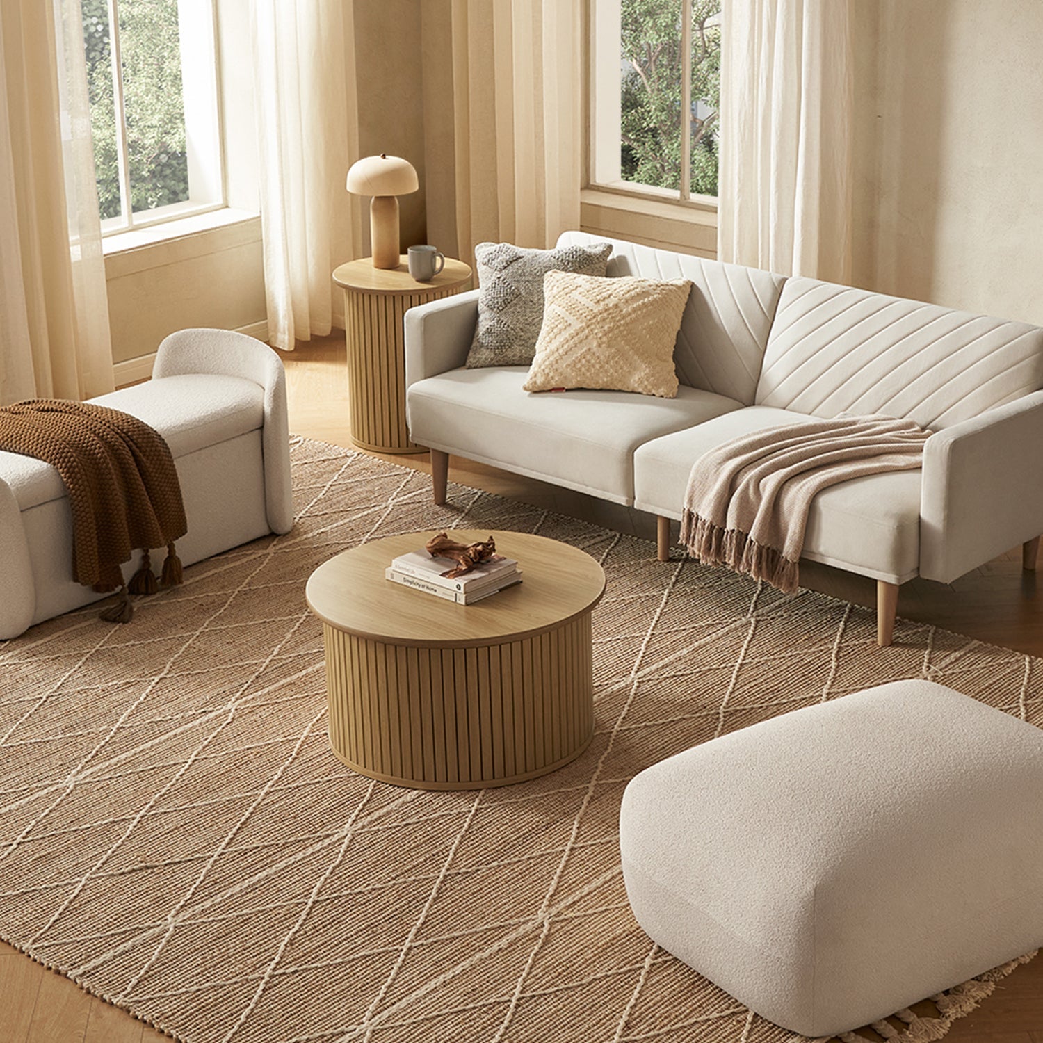 En oval slatted-tambour storage coffee table in Light Oak-effect finish — MOKURRA